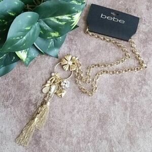 Bebe women's gold toned dangle tassel charm necklace NEW